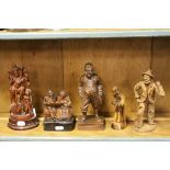 Four Eastern Europe Wooden Carved Figures (tallest 21cms) together with a Carved Wooden South East