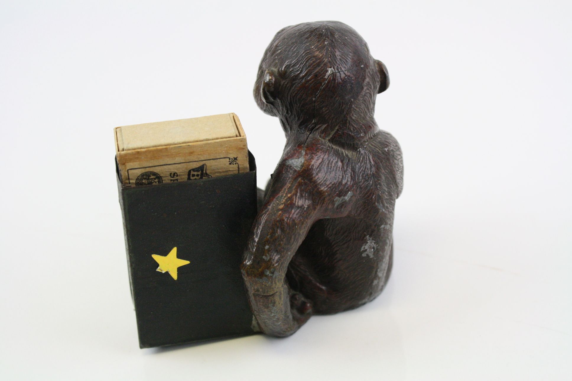 An early 20th century cold painted spelter match holder in the form of a monkey. - Image 6 of 6