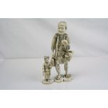 Two Japanese Meiji period ivory okimono figures the larger figure of a man with a sea shell.