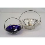 Two fully hallmarked sterling silver bonbon dishes with pierced decoration, one with blue glass