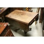 19th century Mahogany Drop Flap Table, drawers to either end, raised on a central turned support