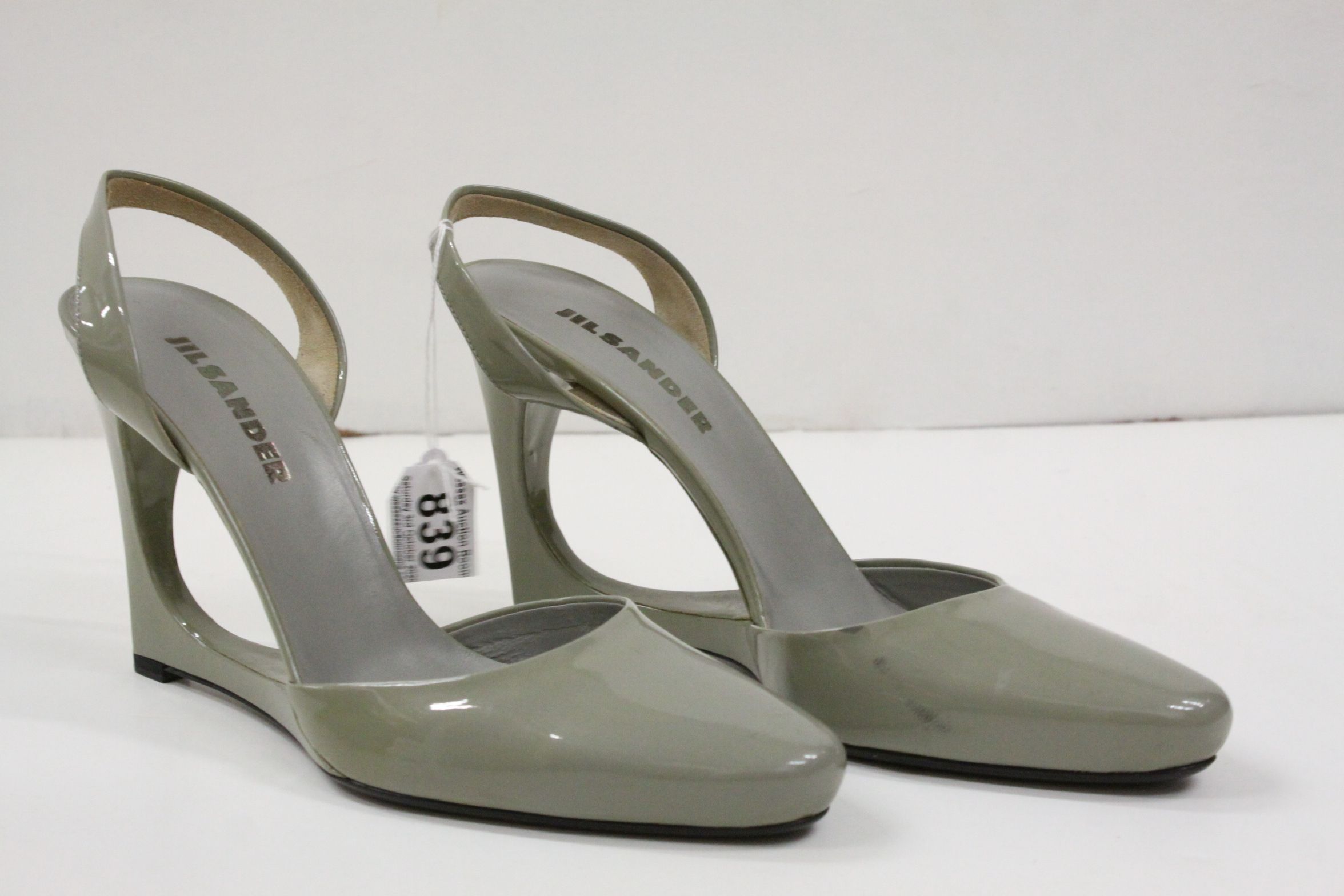 Pair of Jill Sander patent leather green-grey sling back shoes, elongated rounded toe, sculptural
