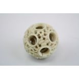 An antique carved ivory chinese puzzle ball.