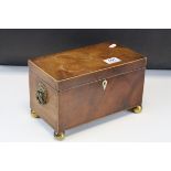 Regency Mahogany Tea Caddy, the hinged lid opening to reveal two covered tea compartments, raised on
