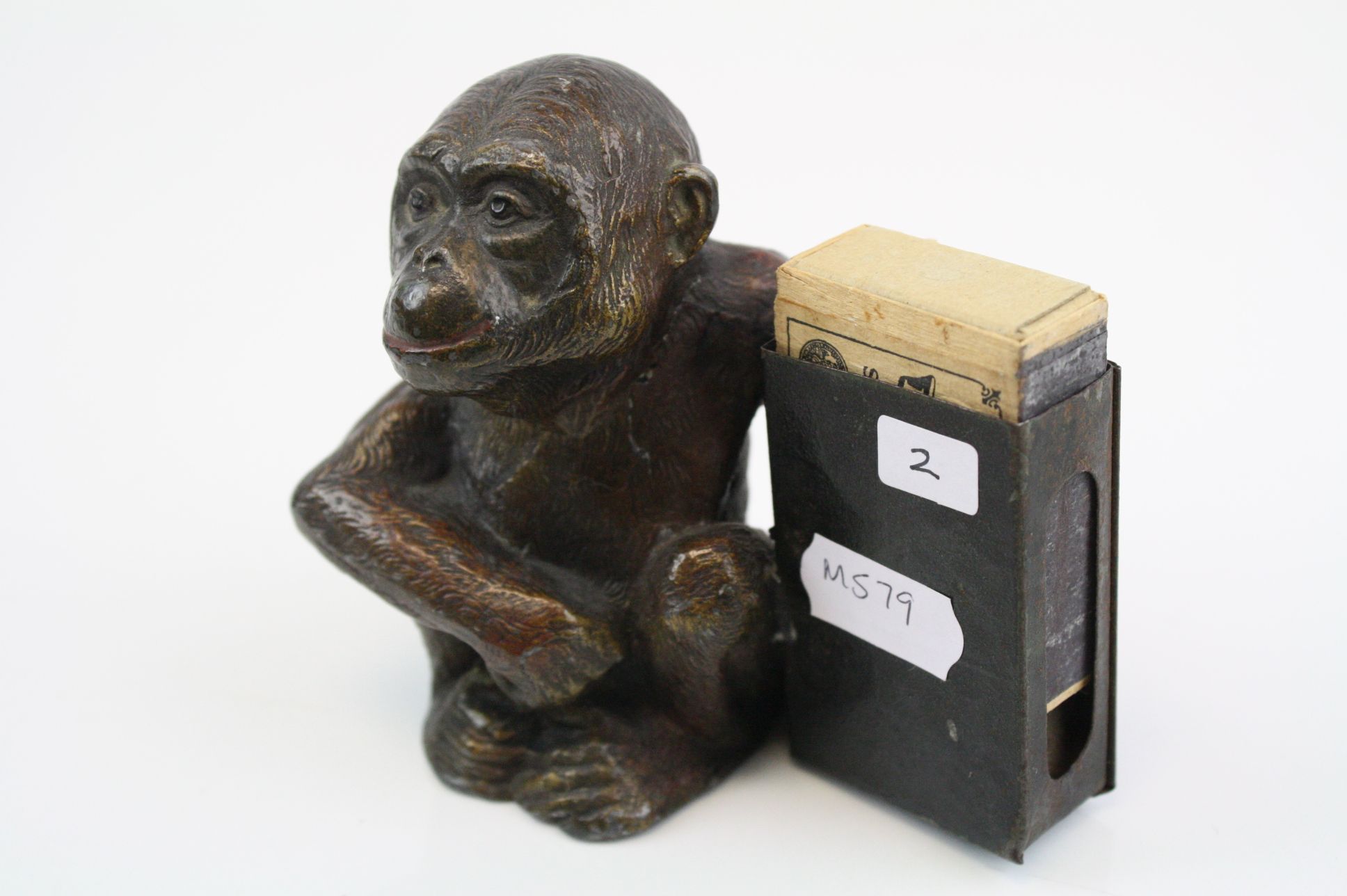 An early 20th century cold painted spelter match holder in the form of a monkey. - Image 4 of 6