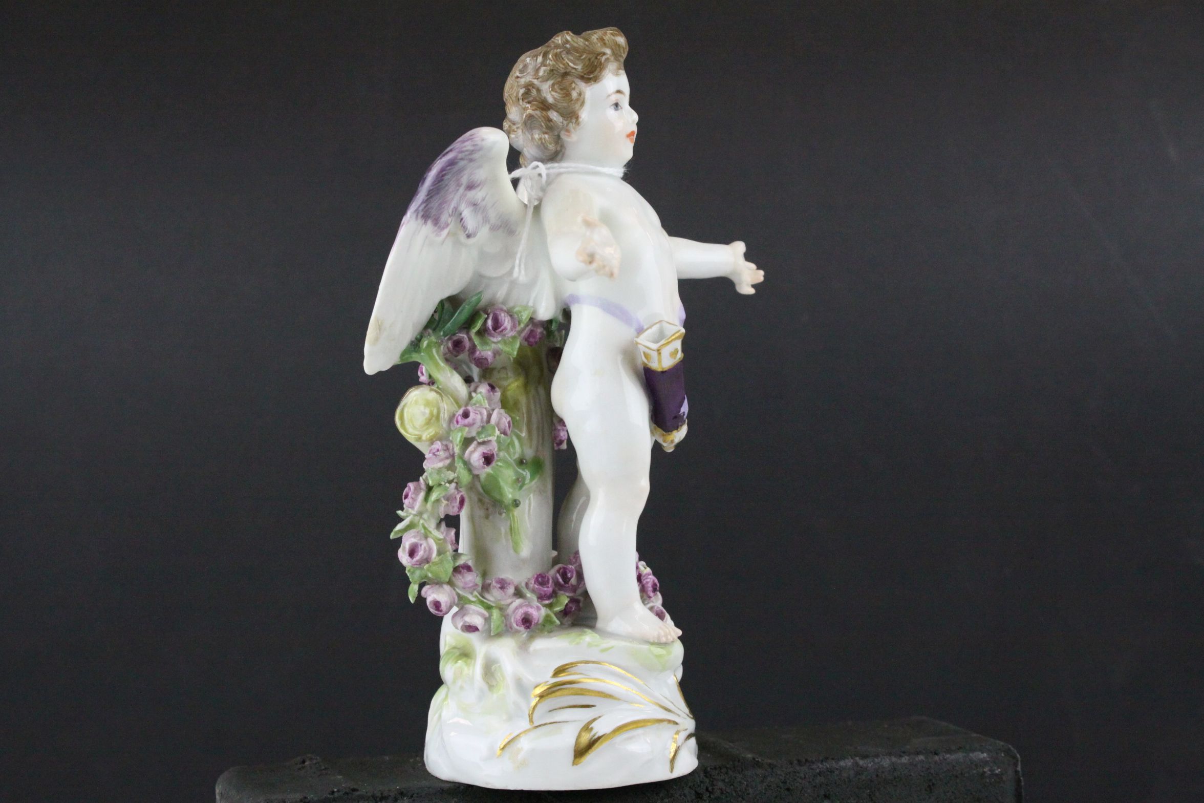 Meissen Porcelain Figure of Cupid with open arms, the base decorated with gilt scrolls, blue cross - Image 4 of 10