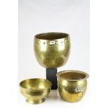 Oriental Brass Bowl, 26cms diameter together with Two Hammered Brass Jardinieres. largest 31cms