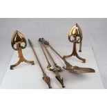 A pair of Copper Art Nouveau andirons decorated with Hearts etc together with a similar companion