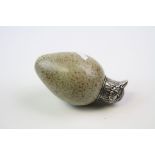 A vintage scent bottle modelled as a birds egg with a white metal top in the form of a birds head