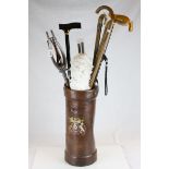 World War Leather Shell Case together with a collection of Walking Sticks, Shooting Stick, etc