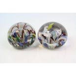 Two 19th century Glass Paperweights, one with internal flower and the other with three stems