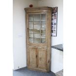 19th century Pine Corner Cabinet, the upper section with a glazed door opening to reveal a painted