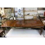 Late 19th century Mahogany Dining Table with rounded corner, raised on turned reeded legs