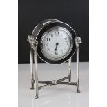 French Empire Style Mantle Clock contained within a Silver Plated Case raised on square pillar