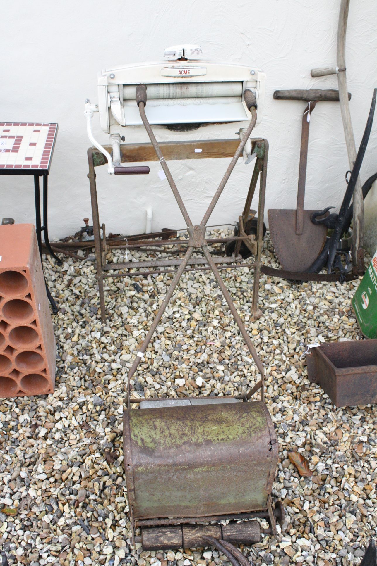 Mid 20th century ' Acme ' Mangle together with a Vintage Push-along Lawn Mowver