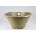 A stoneware 20th century dairy bowl. 46 cm diameter.across top.
