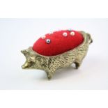 Abrass pin cushion in the form of a pig.