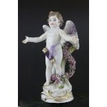 Meissen Porcelain Figure of Cupid with open arms, the base decorated with gilt scrolls, blue cross