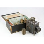 Late 19th / Early 20th century German E.P. Paraffin Magic Lantern with twelve slides fitted in it'
