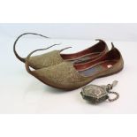 A pair of vintage Persian slippers together with a similar white metal scent bottle.