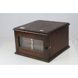 19th century Mahogany Table Top Coin Cabinet, the single glazed door opening to reveal twelve coin