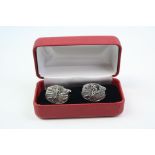 A pair of silver golfing style cufflink's