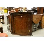 Georgian Oak Hanging Corner Cupboard with single panel door, 81cms high