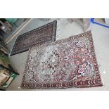 Eastern Red Ground Wool Rug 160cms x 108cms together with a Blue Ground Rug 160cms x 83cms