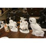 Two Staffordshire dog figures and three Staffordshire figures