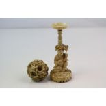 A Vintage oriental carved ivory puzzle ball with stand.