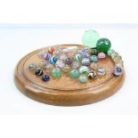 Wooden Solitaire Board together with associated Victorian Glass Marbles