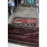 Eastern Red Ground Wool Rug approx.. 163cms x 92cms together with Two other Rugs