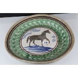 19th century Glazed Pottery Spongeware Charger, the centre decorated with a horse, 43cms diameter