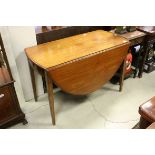 19th century Mahogany Oval Drop Flap Table with drawer to end and raised on square tapering legs,