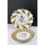 A pair of Meissen gilt and floral scalloped edged decorated plates.