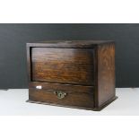 An early 20th century oak smokers cabinet