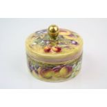 A 20th century porcelain hand painted trinket box decorated with fruit by former Royal Worcester