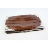 An early 20th century crocodile skin card case/wallet with silver mounts 1912.