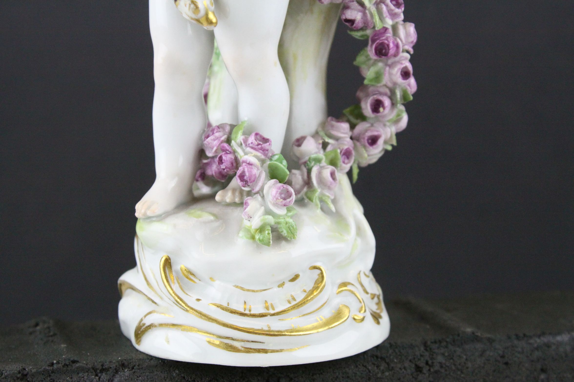 Meissen Porcelain Figure of Cupid with open arms, the base decorated with gilt scrolls, blue cross - Image 3 of 10