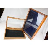 Two Wooden Cased Display Cabinets with glass lids, largest 66cms x 36cms