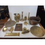A quantity of copper and brass to include cribbage board, vases, candlesticks, Copper Jam Pan etc.