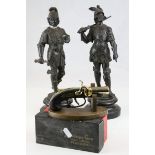 A pair of spelter figures of ancient warriors with broken swords and a boxed Derringer Table