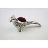 A silver pheasant pincushion