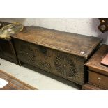 17th century Oak Coffer, the hinged lid opening to reveal an open candle box, the front panel with