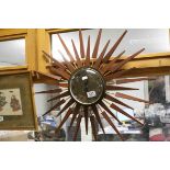 Retro mid century sunburst wall clock with quartz movement.