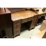 Early 20th century Queen Anne Style Walnut Dressing Table / Desk with an arrangement of seven