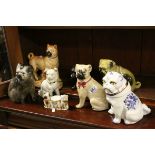 Collection of Eight 19th century and Later Ceramic Pugs, tallest 23cms