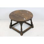 Oak Circular Coffee Table raised on turned and block supports with stretchers, 60cms diameter