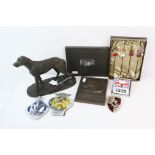 A box of mixed collectables to include a selection of car badges and a Dachshund club of America