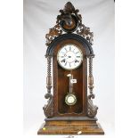 19th century Walnut Cased Regulator Mantle Clock, Carved Dog Mask to Pediment, the white enamel face